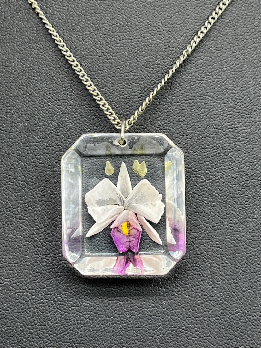 Vintage lucite reverse carved purple white Iris pendant on 16” silver tone chain